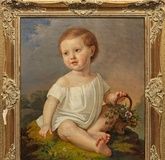 A little child with a basket of flowers: a sensitive late Biedermeier canvas