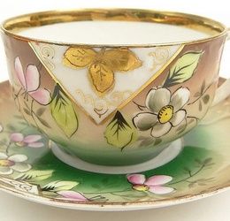 19/20th Century Russian Kuznetsov Porcelain Factory Painted and Gilt Porcelain Tea Cup and Saucer with Inscription "Day of the Angel". Signed and with Imperial Warrant Mark. Rubbing to Gilt and Very Small Chip to Rim of Saucer Otherwise Good