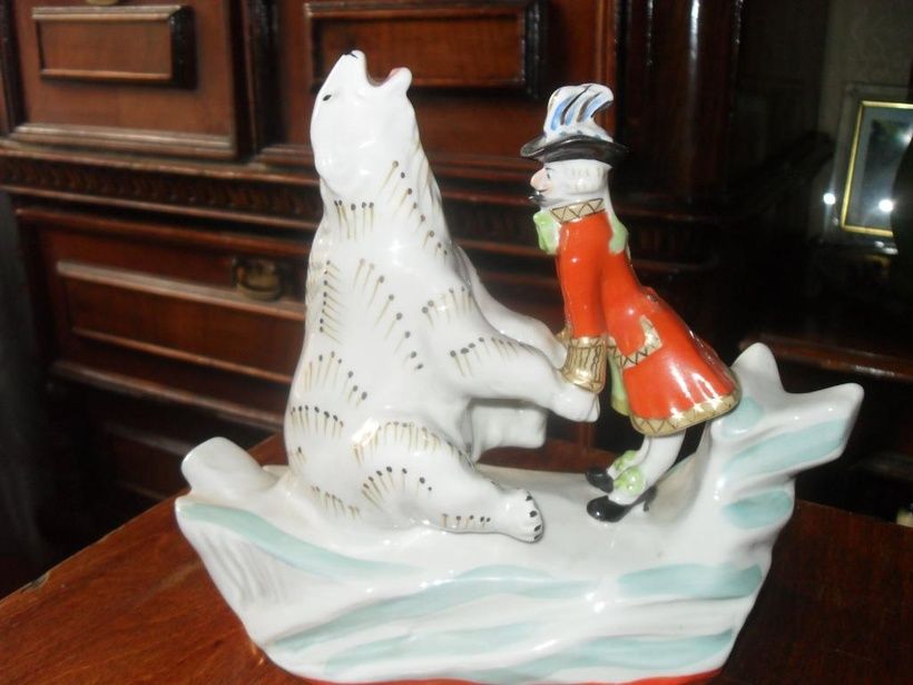 Porcelain figurine of Baron Munchausen and the White Bear of the USSR.
