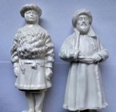 Two porcelain statues representing the peoples of Russia.