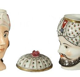 A PAIR OF RUSSIAN PORCELAIN HEAD SHAPED CUPS, one