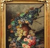 "Fruits and floral still life: grapevines, roses, and chrysanthemums arranged in a picturesque order"