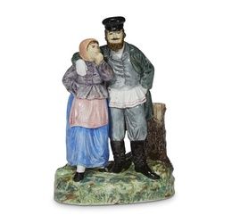 A Russian porcelain group "Peasant Couple", M.S. Kuznetsov Manufactory, Tver, 1889-1917